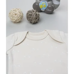 Body de bebé beige con flores estampadas