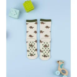 Calcetines antideslizantes beige de niño con dinosaurios