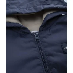 Chaqueta cortavientos azul con forro polar