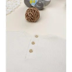 Jersey de niña beige con cervatillo bordado