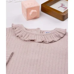 Jersey rosa de cuello alto para niña