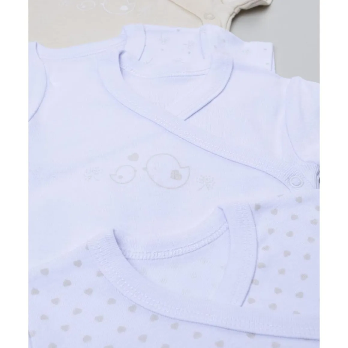 Pack 5 bodies de manga corta para niña en beige y blanco